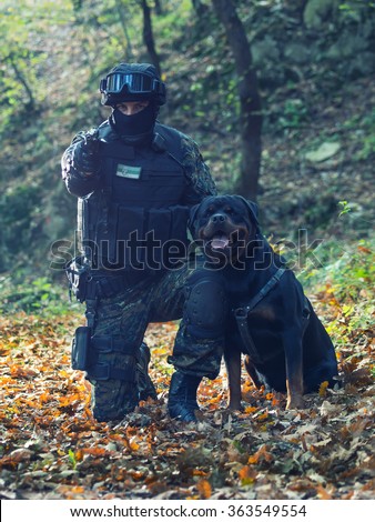 Police special forces,filtered and under exposed photo.National flag on his arms and chest