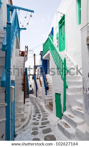 Mykonos street with external colourful stairs of the houses