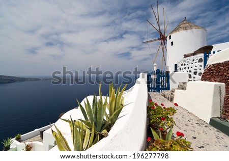 Santorini island sea view and windmill in the front