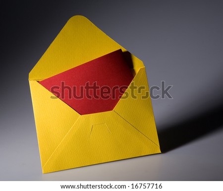 open yellow envelope with red paper