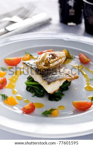 sea bass on spinach