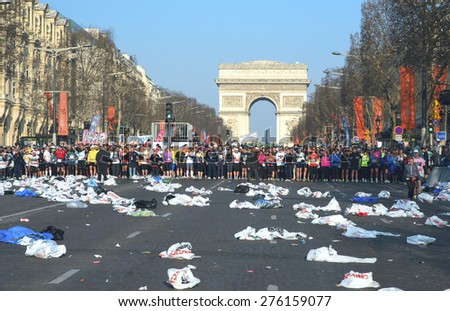 PARIS, FRANCE - APRIL 07: Group of runners start on Champs Elysees the Paris Marathon, April 07, 2013  in Paris, France