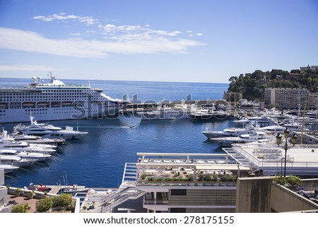 MONTE CARLO, MONACO - APRIL 28: View on Port Hercules with luxurious yachts and a cruise ship on April 28, 2015 in Monte Carlo, Monaco.