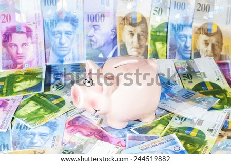 Piggy bank with  Swiss francs