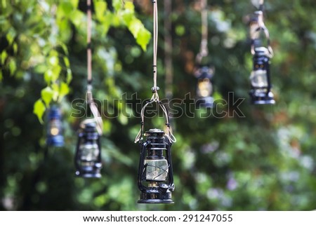 vintage kerosene oil lantern lamp hanging on the wire