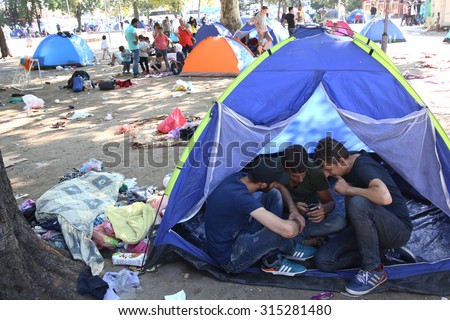 SERBIA, BELGRADE - September 01,2015: Park at the station migrants from Syria have turned into a small city. Some have even set up tents and in which they reside, while most sleep under the open sky.