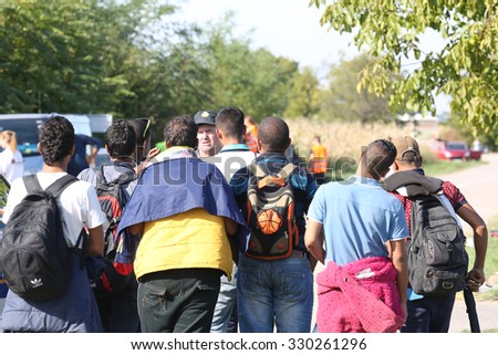 Opatovac, Croatia - October 5, 2015; Refugees entering refugee camp in Opatovac enear the border. They will be here only one day and then they will continue into Hungary.