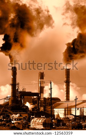 Menacing fumes arising from the smokestacks of an industrial plant