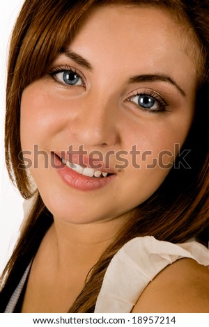 A blue eyed smiling young hispanic woman with a hopeful expression