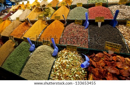assorted herbs and spices in the market, cloves, nutmeg, curry, chili powder, crushed chillies, dill seed, thyme, peppercorn, anise