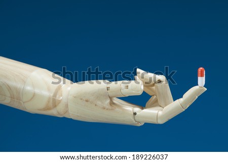 Robot hand with pill