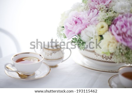 the image of flowers and tea set