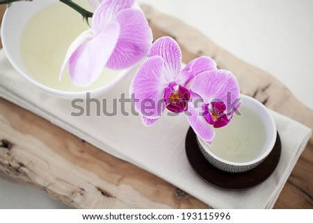 the image of orchid flower and tea