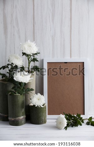 the image of flowers in wooden vases