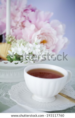 the image of flower and tea cup