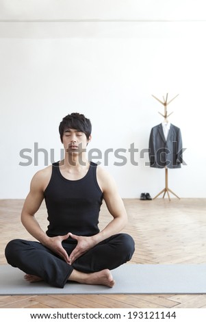 Korean man doing yoga