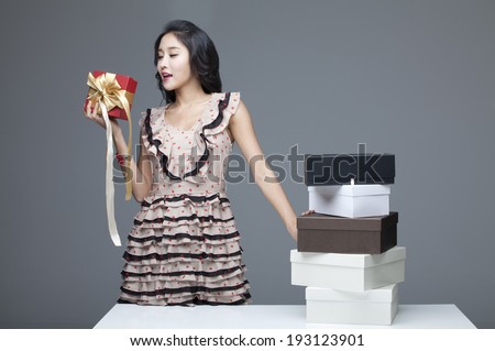 Korean woman with shopping bags and shoe boxes