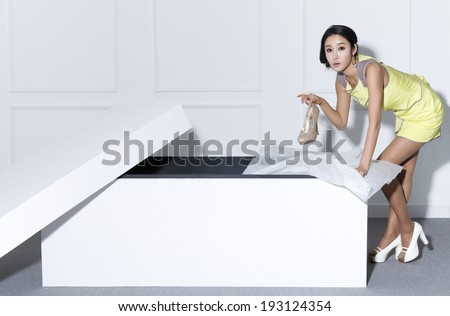 Korean woman with paper shopping bags and shoe box