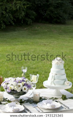 the image of wedding cake and table setting
