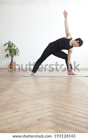 Korean man doing yoga