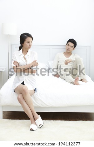 Asian couple disputing