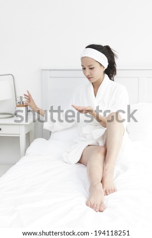 Asian woman in bath robe