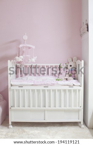 the image of parenting and baby girl crib