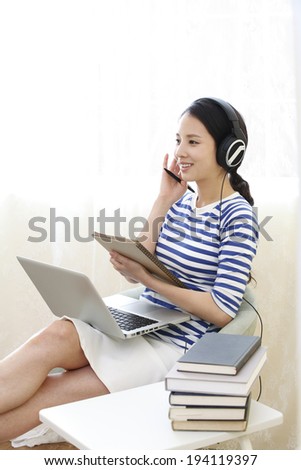 the image of Asian woman on laptop