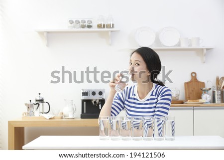 the image of Asian woman drinking water