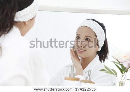 the image of Asian woman cleansing face