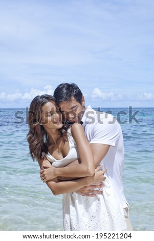the image of couple hugging by the sea in Boracay in the Philippines