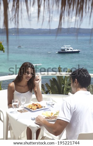 the image of Asian couple eating by the sea in Boracay in Philippine
