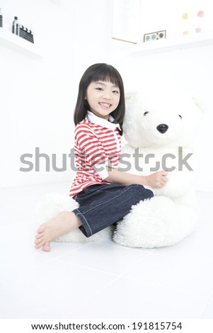 The image of smiling child with teddy bear in Korea,Asia