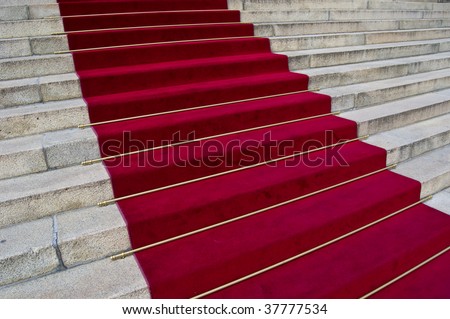 beautiful red carpet leading up old steps