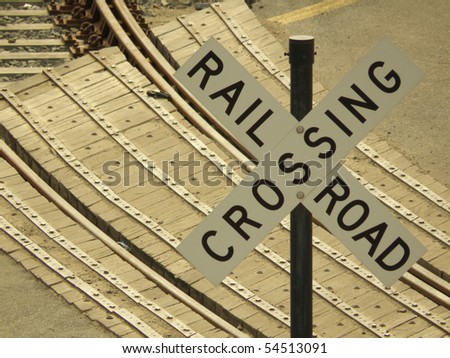 sign warning of a railroad crossing and possible trains