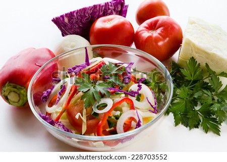 Salad of red and white cabbage  in a plate on a white background. Vegetable diet.