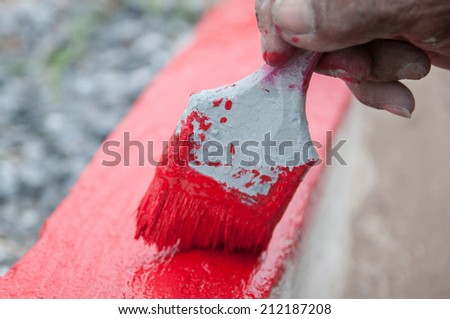 Red paint brush.