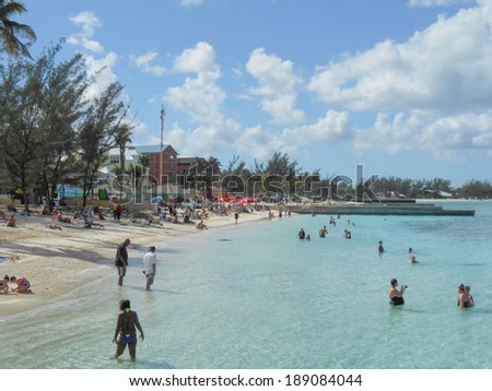 NASSAU, BAHAMAS - FEBRUARY 06, 2014: Tourists on the beach at Nassau Bahamas USA