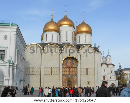MOSCOW, RUSSIA - OCTOBER 20, 2012: Tourists visiting the Cathedral of the Dormition Russian Orthodox church dedicated to the Dormition of the Theotokos