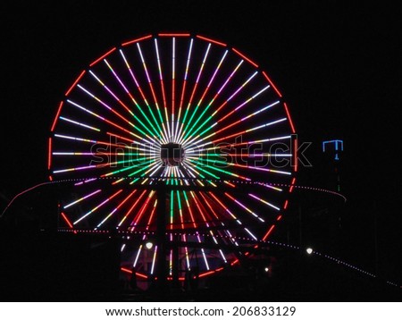 LOS ANGELES, USA - JANUARY 30, 2013: Pacific Park amusement park lights at night in Santa Monica Los Angeles California