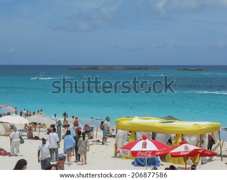 NASSAU, BAHAMAS - MAY 28, 2014: Tourists on the beach at Nassau Bahamas