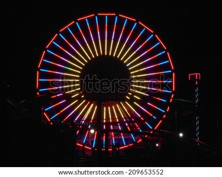 LOS ANGELES, USA - JANUARY 30, 2013: Pacific Park amusement park lights at night in Santa Monica Los Angeles California