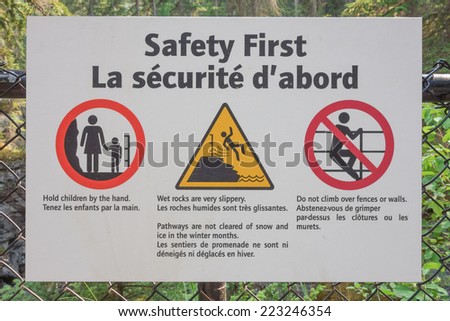 JASPER, CANADA - AUGUST 15, 2014: Safety sign in English and French in Jaspern National Park in Alberta Canada