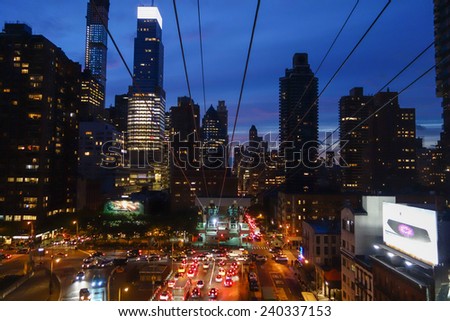 NEW YORK, USA - SEPTEMBER 25, 2014: The Roosevelt Island Tramway is an aerial tramway that spans the East River and connects Roosevelt Island to the Upper East Side of Manhattan