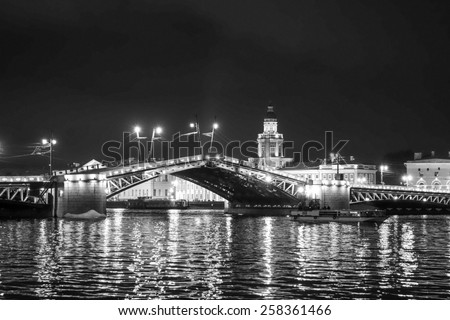 The Palace Bridge is a road traffic and foot bascule bridge spanning the Neva River in Saint Petersburg between Palace Square and Vasilievsky Island in black and white