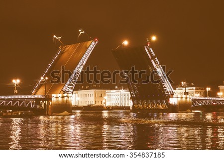 Vintage looking The Palace Bridge is a road traffic and foot bascule bridge spanning the Neva River in Saint Petersburg between Palace Square and Vasilievsky Island