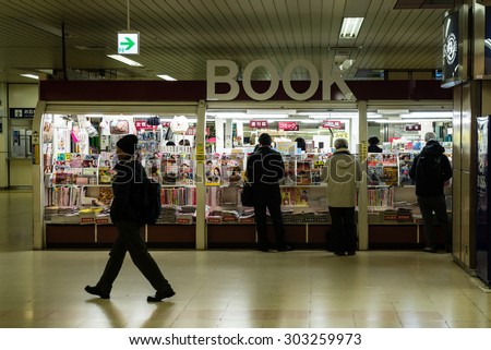 SAPPORO, JAPAN - JANUARY 11, 2015: People reading in bookstore.