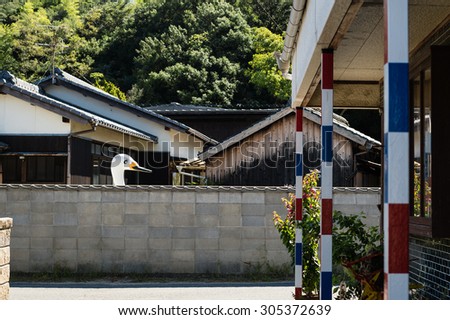 NAOSHIMA, JAPAN - SEPTEMBER 14, 2014: Large swan model in Naoshima street.
