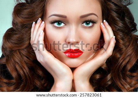 Gorgeous Young Woman Portrait. Beauty Face. Perfect skin, Red sexy Lips. Brown Curly Volume Hair.