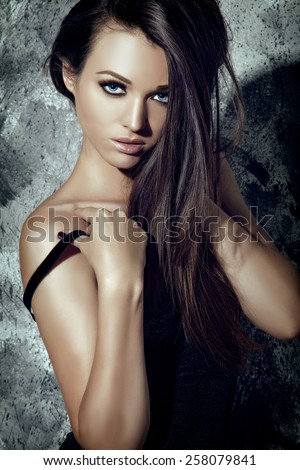 Seductive Fashion Model Girl. Beauty Young Woman Portrait. Dark Long Hair, Tan Bronze Skin.